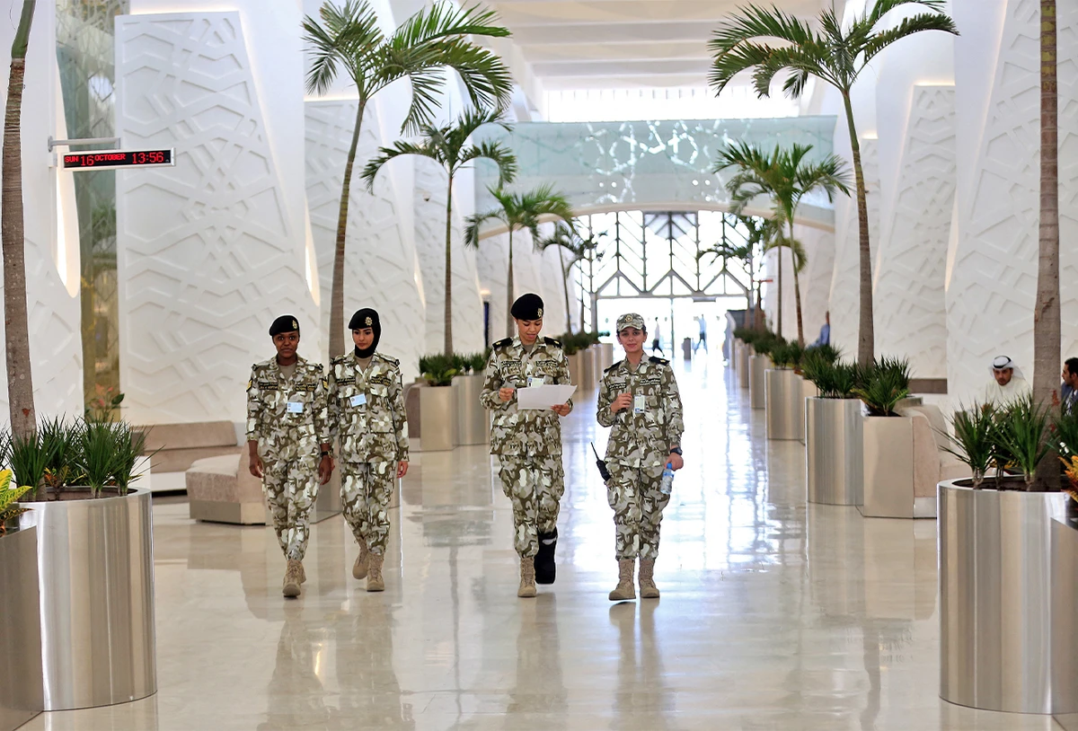 Kuwaiti female National Assembly guards walk inside the building in Kuwait City on October 16, 2016. (AFP/File)