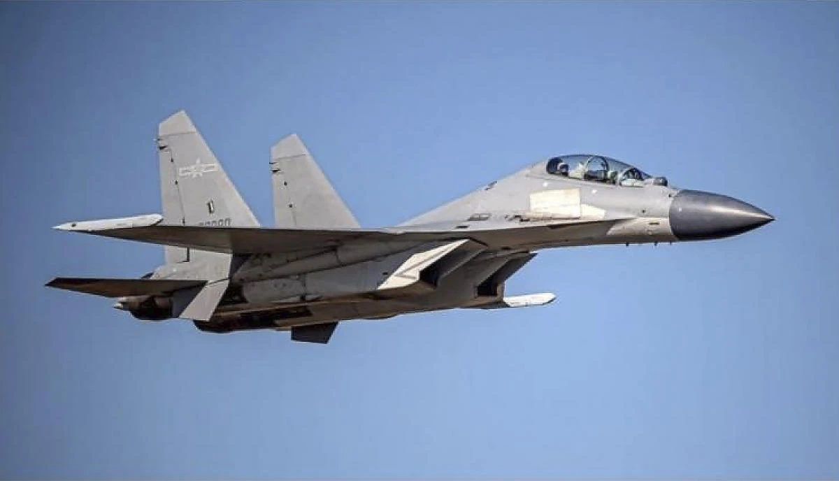 Above, a Chinese PLA J-16 fighter jet flies in an undisclosed location. China mounted four straight days of mass air force incursions into Taiwan’s air defense identification zone that began Oct. 1. (Taiwan Ministry of Defense via AP)