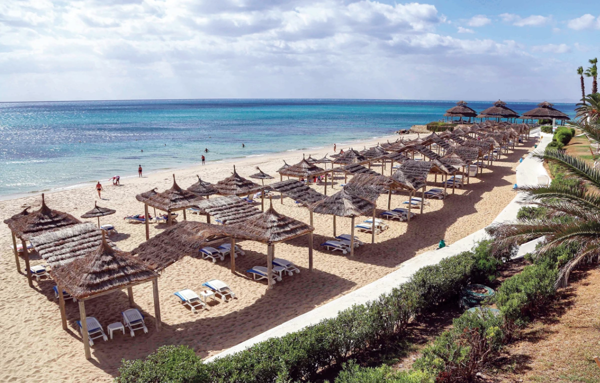 Empty sunbeds and shades are seen along a beach in Tunisia’s resort town of Hammamet, about 66 km south of the capital Tunis. (AFP)