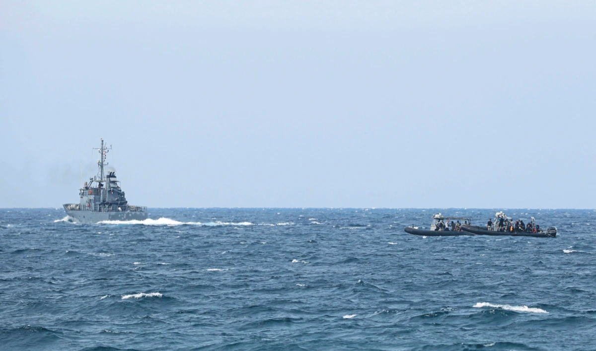 Lebanese coast and rescue personnel conduct a search operation after a small training aircraft crashed off the coast of Halat town, north of the capital Beirut, on Wednesday. (AFP)