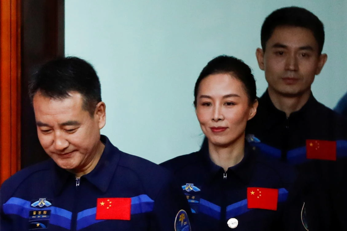 Astronauts Zhai Zhigang, Wang Yaping and Ye Guangfu arrive for a meeting ahead of the launch of the Long March-2F Y13 rocket, carrying the Shenzhou-13 spacecraft and them in China’s second crewed mission to build its own space station. (Reuters)