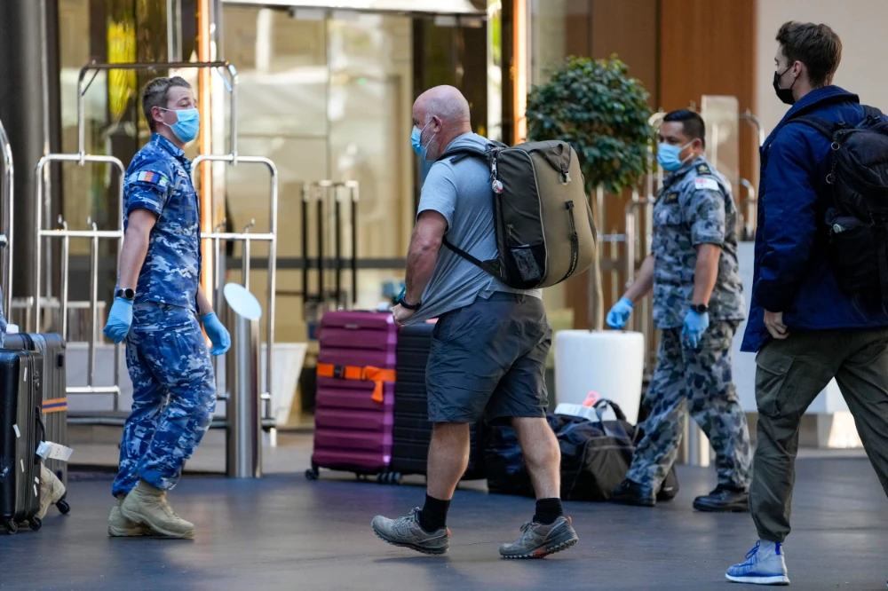 Currently, anyone who enters Australia has to qualify for an exemption to travel and fork out many thousands of dollars to be locked in a hotel room for 14 days. (AP)
