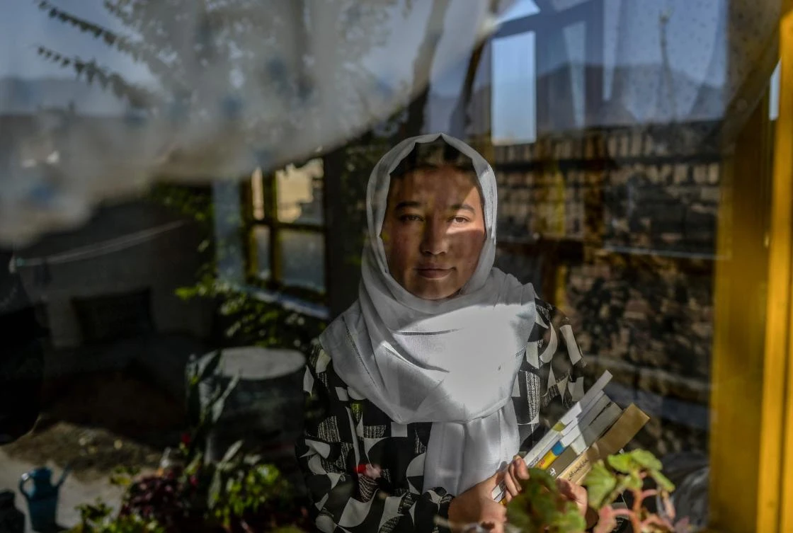 Amena, above, at her home in western Kabul, is determined to continue her education but Afghanistan’s new Taliban leadership has barred girls like her from going to school. (AFP)