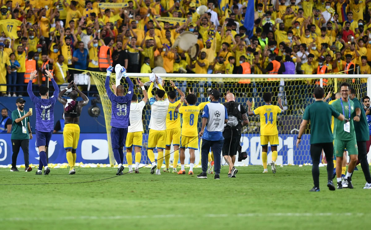 AL-Nassr's players celebrate reaching the 2021 AFC Champions League semifinals after beating Al-Wahda of the UAE 5-1. (Basheer Saleh)
