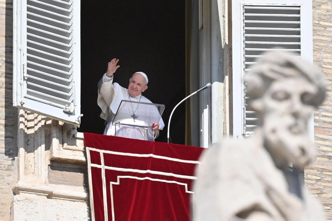 Pope Francis greets the public in St. Peter’s Square for his customary Sunday remarks and blessings from a window of the Apostolic Palace. (AFP)