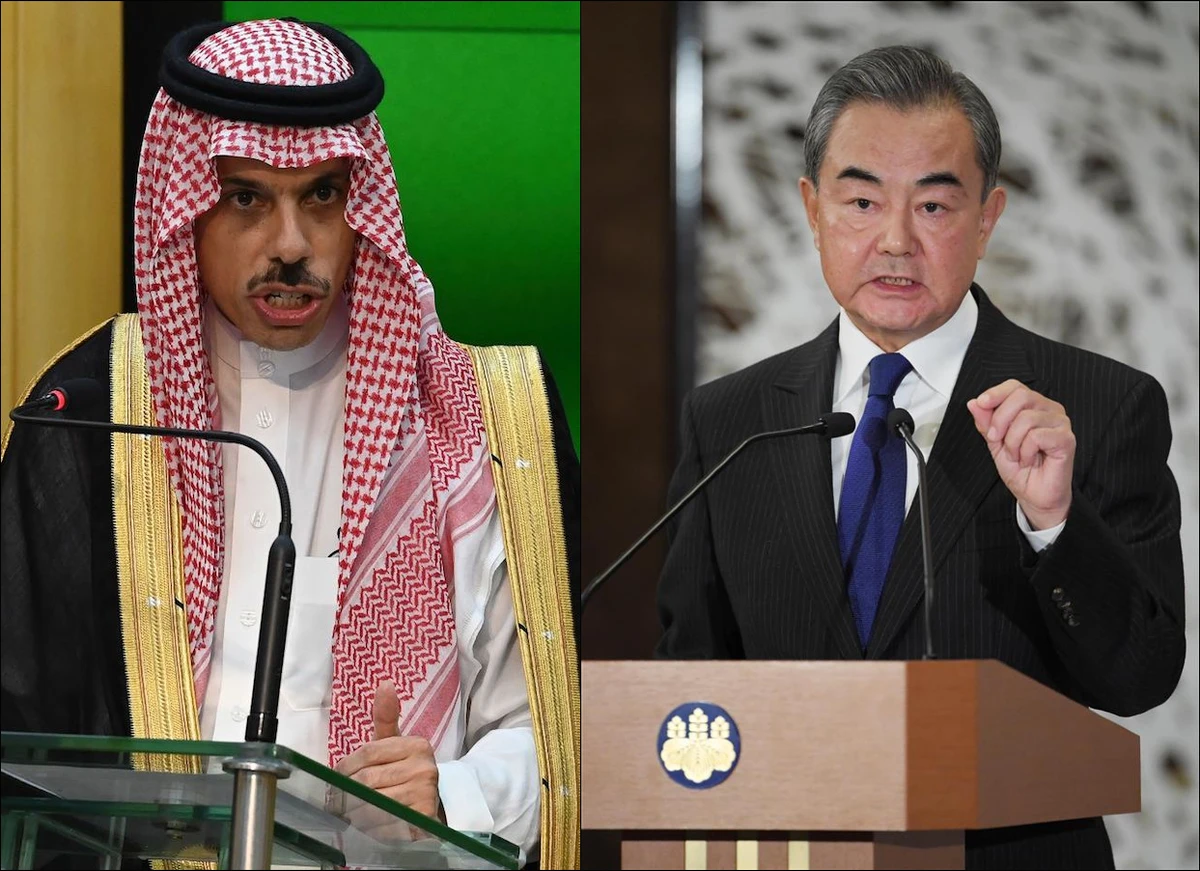 Saudi Arabian Foreign Minister Prince Faisal bin Farhan (L) makes a phone call to his Chinese counterpart Wang Yi. (File/AFP via Getty Images)