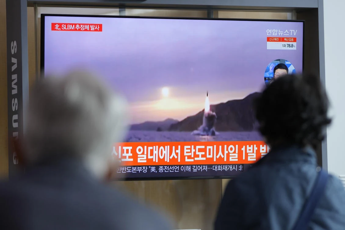 People watch a TV screen showing a news program reporting about North Korea's missile launch with file footage at a train station in Seoul, South Korea, Tuesday, Oct. 19, 2021. (AP)
