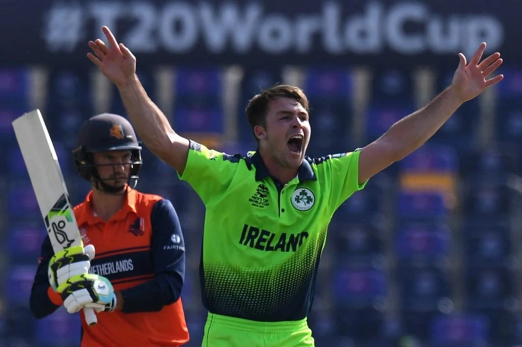 Ireland’s Curtis Campher, right, celebrates after taking the wicket of Netherland’s Scott Edwards during the ICC men’s Twenty20 World Cup cricket match in Abu Dhabi on Oct. 18, 2021. (AFP)