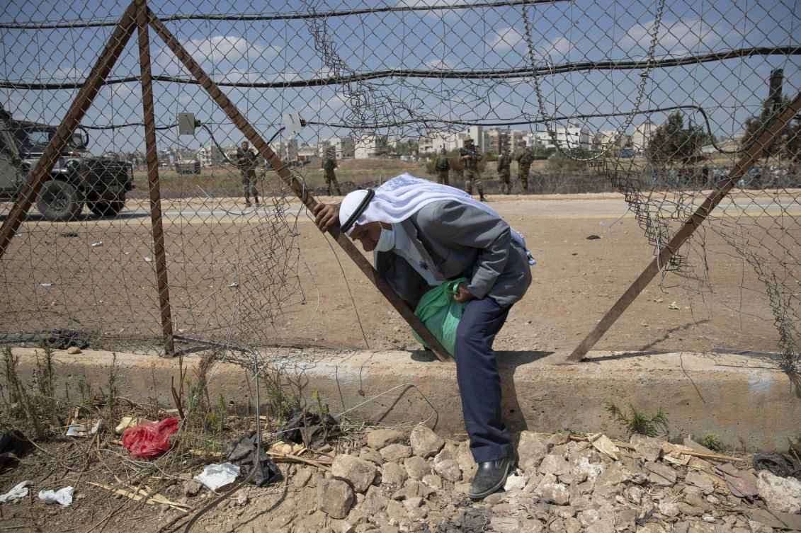 Israel said Tuesday it would grant legal residency to 4,000 Palestinians living in the occupied West Bank and Gaza, a gesture that will allow people who’ve lived under restrictions for years to get official IDs. (AP)