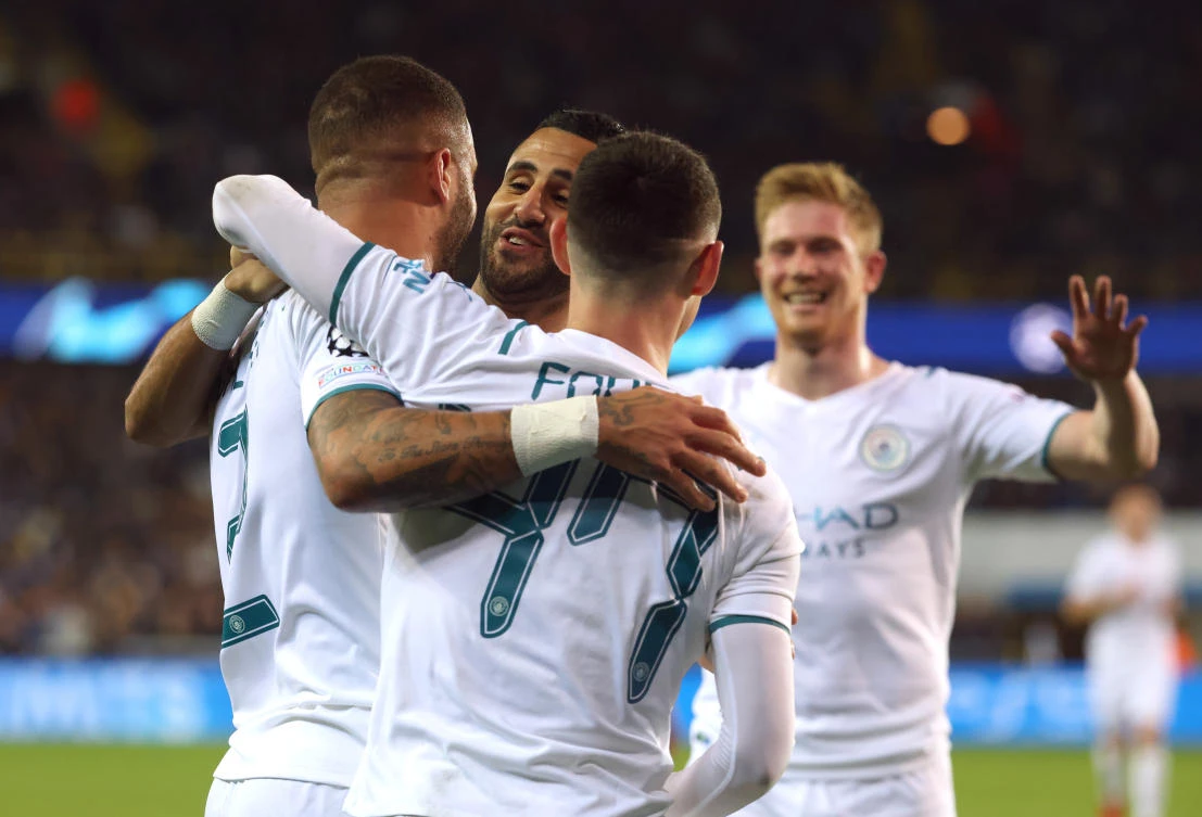 Manchester City’s Kyle Walker celebrates scoring their third goal with Phil Foden, Riyad Mahrez and Kevin De Bruyne in their Champions League match against Club Brugge at Jan Breydel Stadium, Bruges on Tuesday. (Reuters)