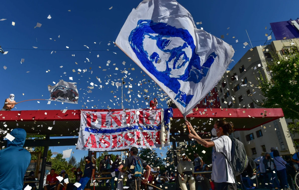 Protesters demonstrate to mark the second anniversary of months of civil unrising against social inequality, in Santiago, on October 18, 2021. (AFP)