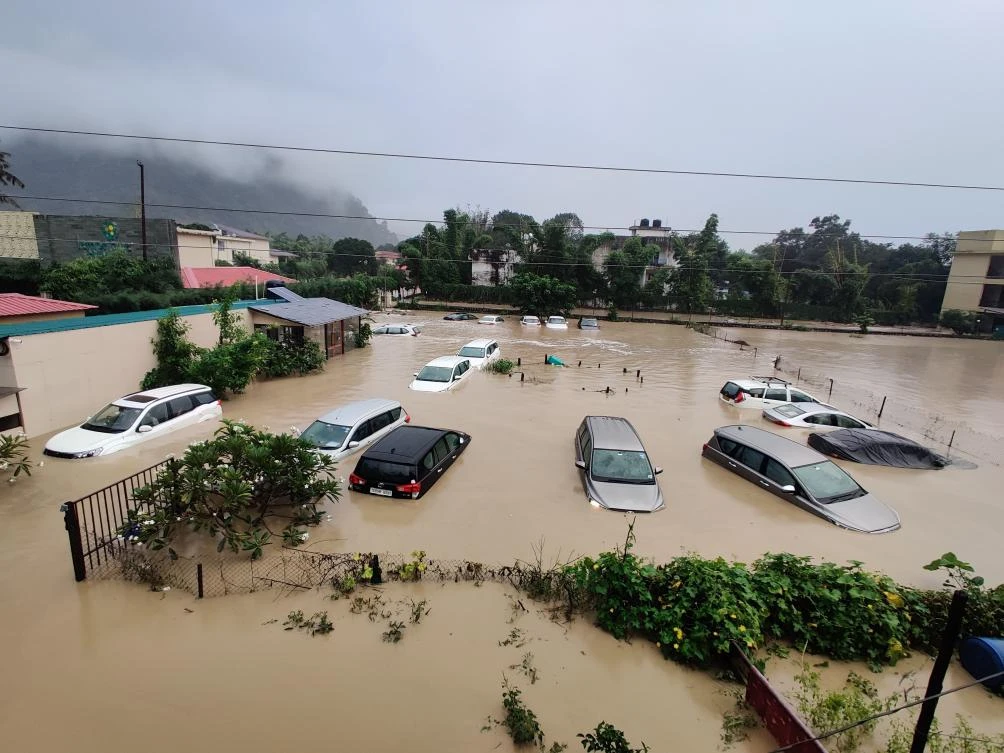 Submerged cars are seen at a flooded hotel resort as extreme rainfall caused the Kosi River to overflow at the Jim Corbett National Park in Uttarakhand, India, Tuesday, Oct. 19, 2021. (AP)