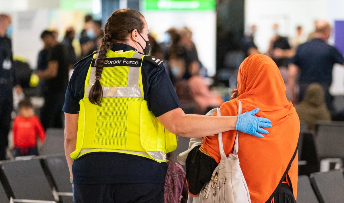But local councils across Britain are struggling to deal with the influx of refugees and the logistical challenges they pose. (AFP)