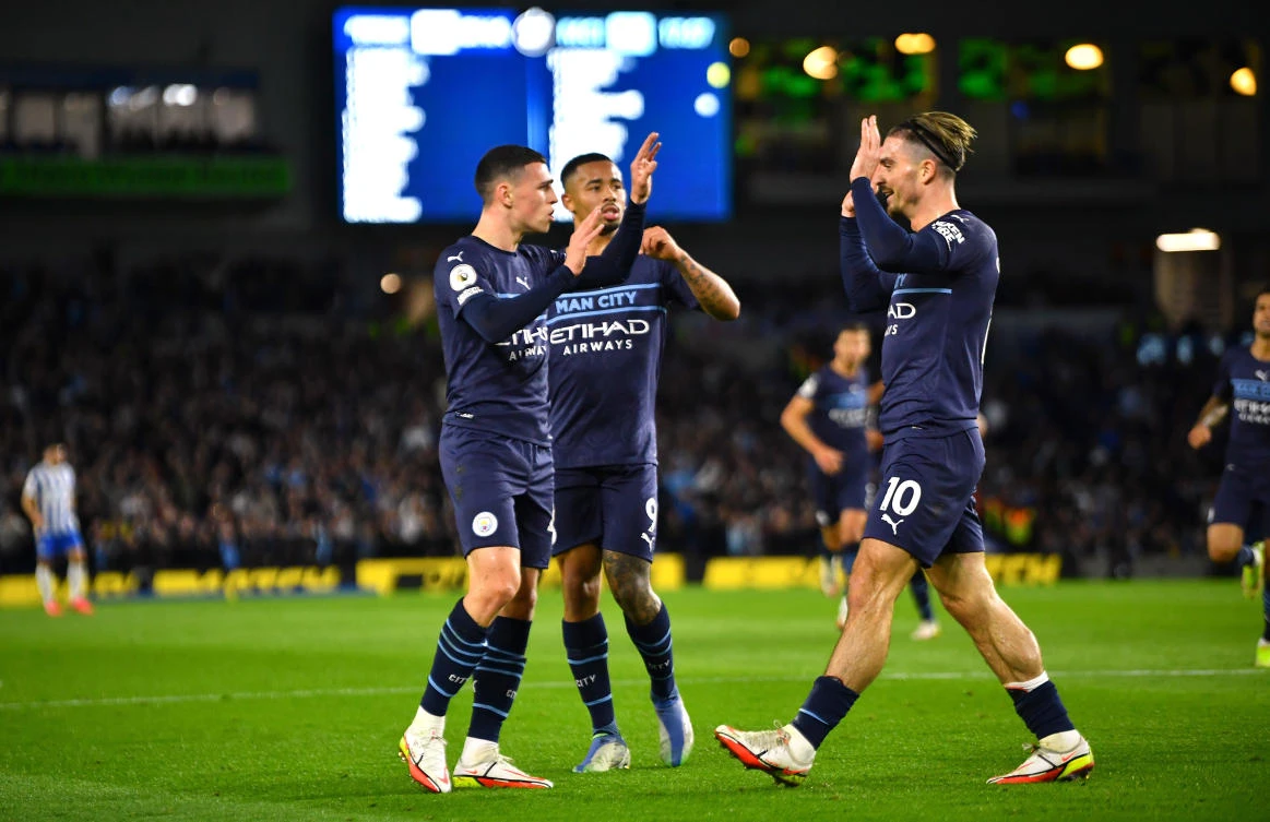 Manchester City’s Phil Foden celebrates scoring their second goal with Gabriel Jesus and Jack Grealish in their game against Brighton & Hove Albion at The American Express Community Stadium, Brighton on Saturday. (Reuters)
