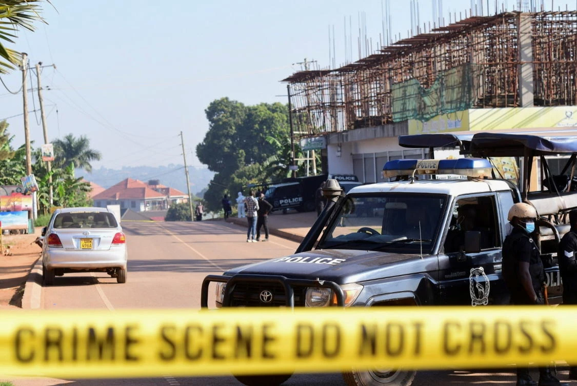 Police officers secure the scene of an explosion in Komamboga, a suburb on the northern outskirts of Kampala, Uganda on Oct. 24, 2021. (Reuters)
