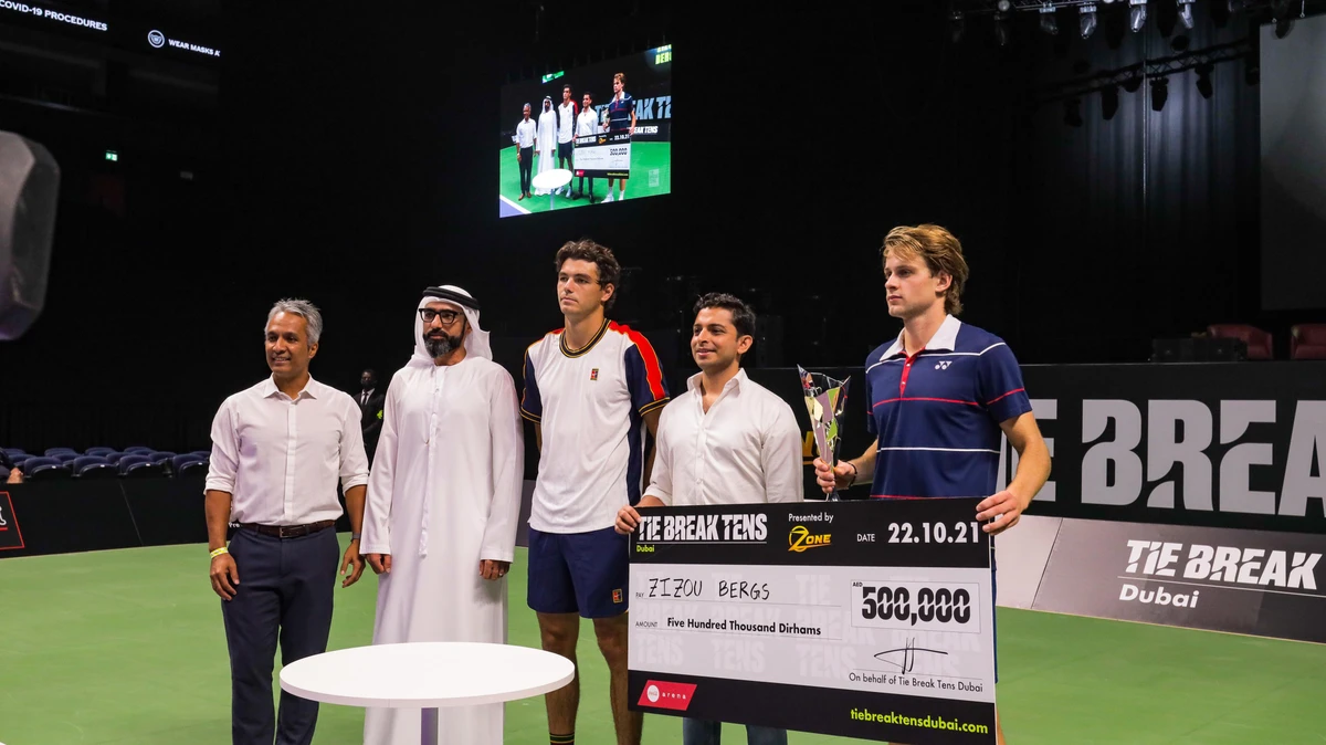 Zizou Bergs, right, with his trophy and prize cheque after winning the inaugural Tie Break Tens in Dubai. (Tie Break Tens)