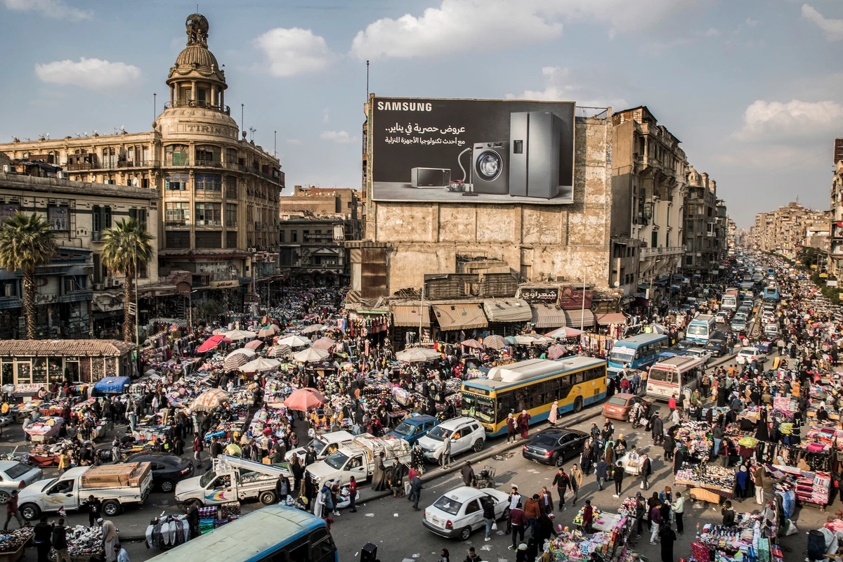 General view of vehicles stuck in a traffic jam amidst street vendors in the central Attaba district of Egypt’s capital Cairo on This picture taken on Feb. 22, 2021. (File/AFP)