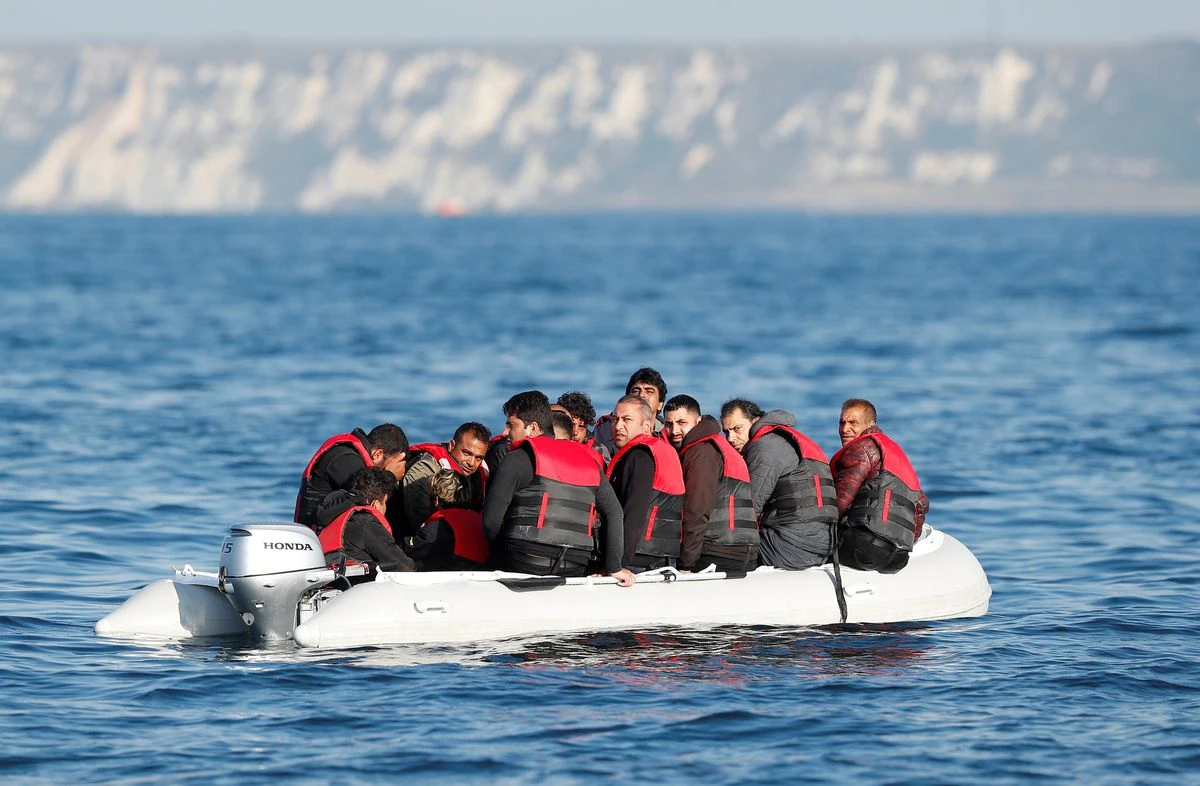 Migrants who launched from the coast of northern France cross the English Channel in an inflatable boat near Dover, England, Aug. 4, 2021. (Reuters)