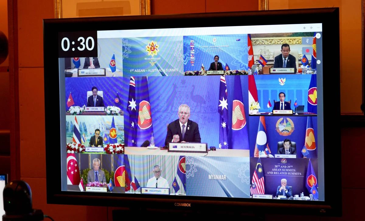 Above, Australian Prime Minister Scott Morrison, center, attends the Association of Southeast Asian Nations (ASEAN) leaders summit. (Australian Prime Minister’s Office via AFP)