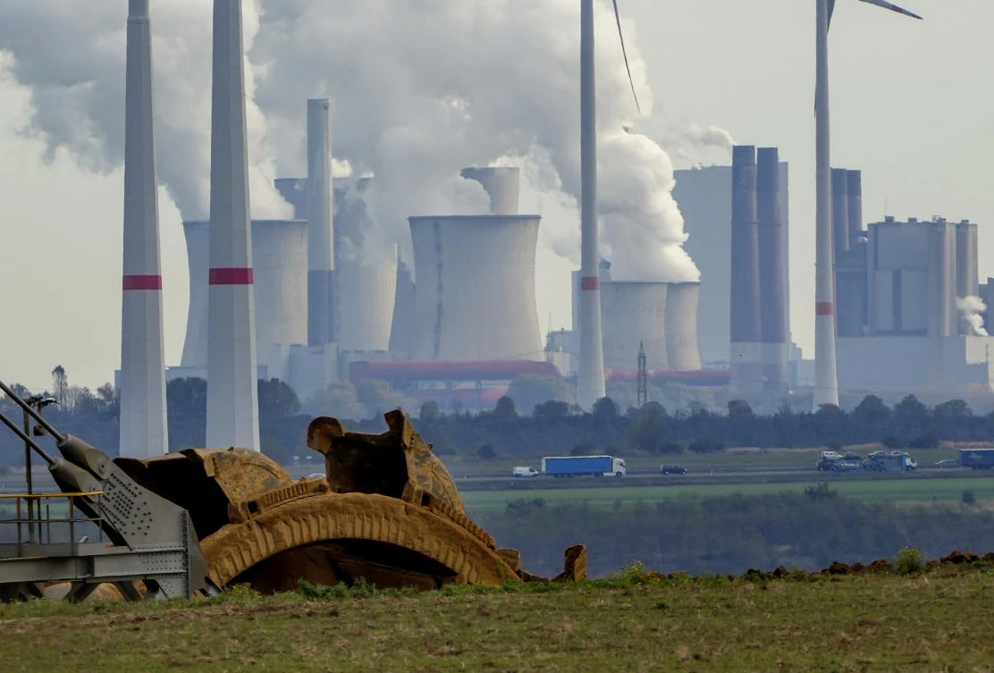 Steam comes out of the chimneys of the coal-fired power station Neurath near the Garzweiler open-cast coal mine in Germany. The climate change conference COP26 will start next Sunday in Glasgow. (AP)