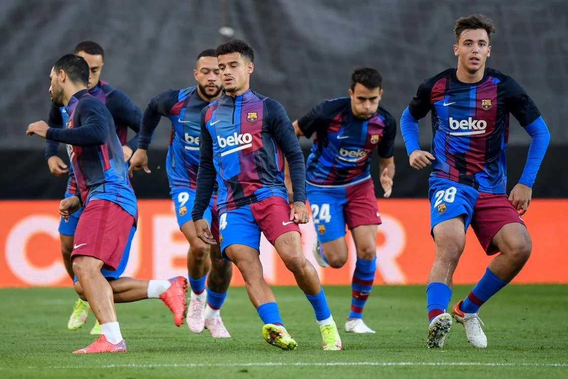 Barcelona’s players warm up before the start of the Spanish League football match between Rayo Vallecano de Madrid and FC Barcelona at the Vallecas stadium in Madrid on Wednesday. (AFP)