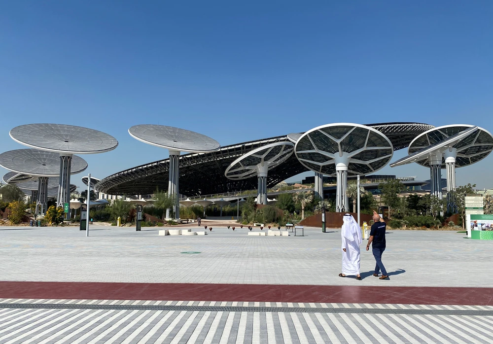 People walk at the site of Dubai Expo 2020 in Dubai, United Arab Emirates, January 16, 2021. (Reuters)