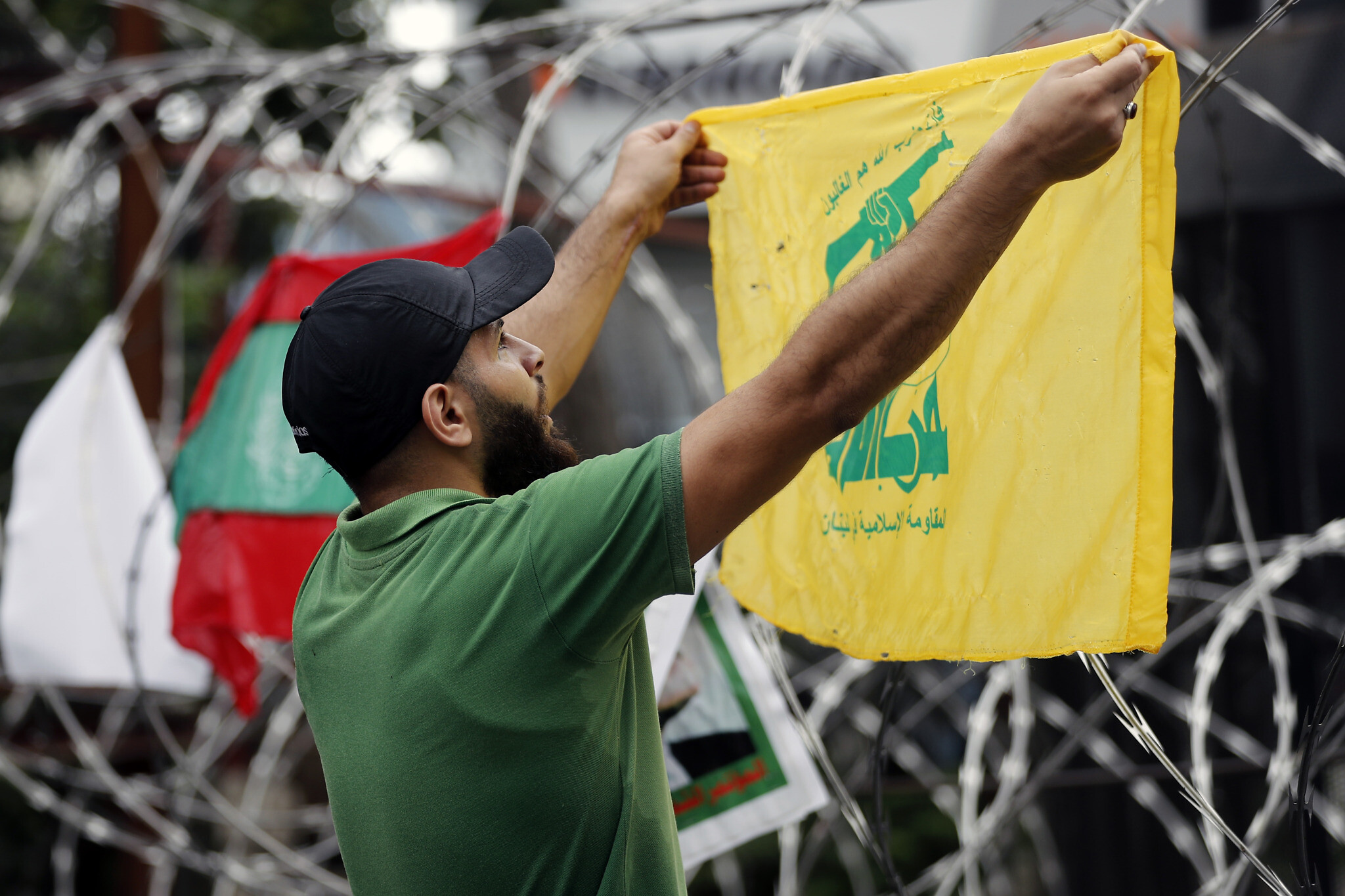 A Hezbollah supporter protests US involvement in Lebanon’s affairs, near the US embassy in Aukar, northeast of Beirut, Lebanon, July 10, 2020. (AP Photo)