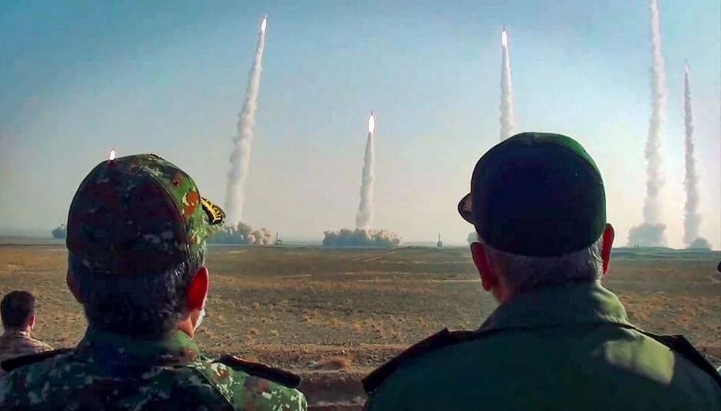 Iran's Revolutionary Guard Corps chief Hossein Salami watching a launch of missiles during a drill earlier this year. (AFP/File)