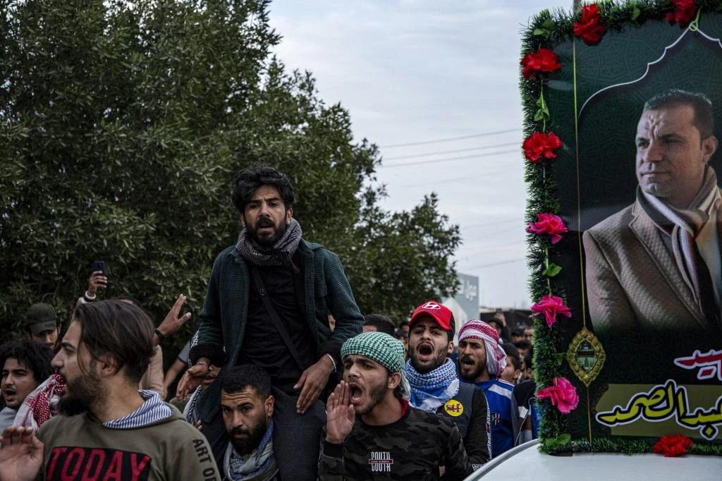 Protesters chant slogans as they participate in a memorial march for the two slain journalists in the southern Iraqi city of Basra on Jan. 17, 2020. (AFP)