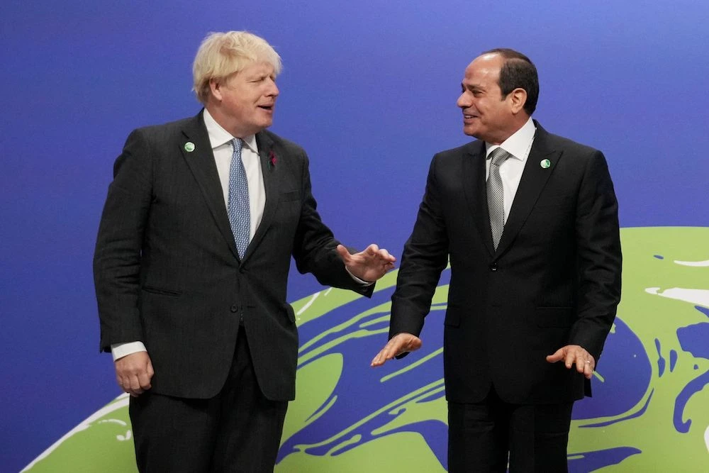 UK Prime Minister Boris Johnson (L) greets Egypt’s President Abdel Fattah El-Sisi as they arrive to attend the COP26 UN Climate Change Conference in Glasgow, Scotland on Nov. 1, 2021. (AFP)