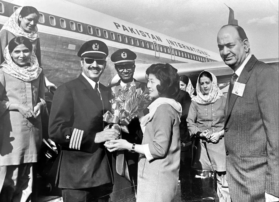 In this undated photo, Capt. Fazal Ghani Mian is welcomed with a flower bouquet at the Beijing airport, China. (Photo courtesy: Capt. Fazal Ghani Mian family)