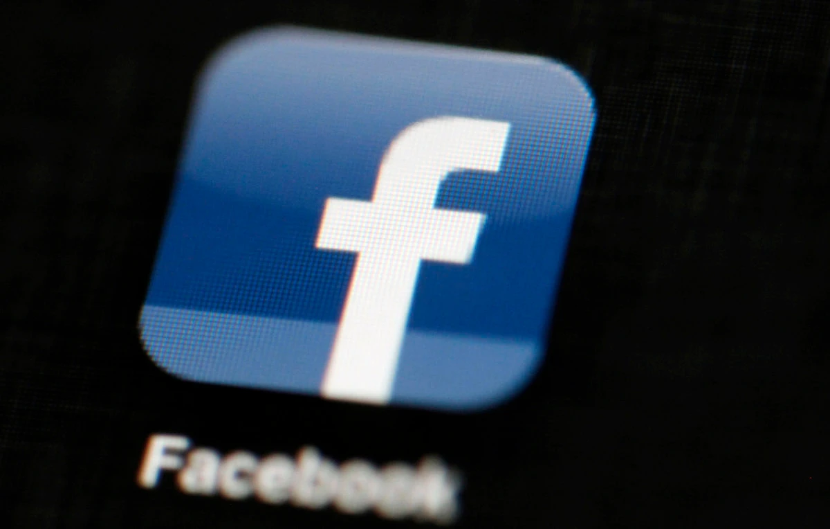 In this May 16, 2012, file photo, the Facebook logo is displayed on an iPad in Philadelphia. Facebook said it will shut down its face-recognition system and delete faceprints of more than 1 billion people. (AP)