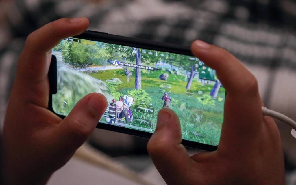 People are spending more time on their smartphones and lots of that time is going on mobile games. (AFP file photo)