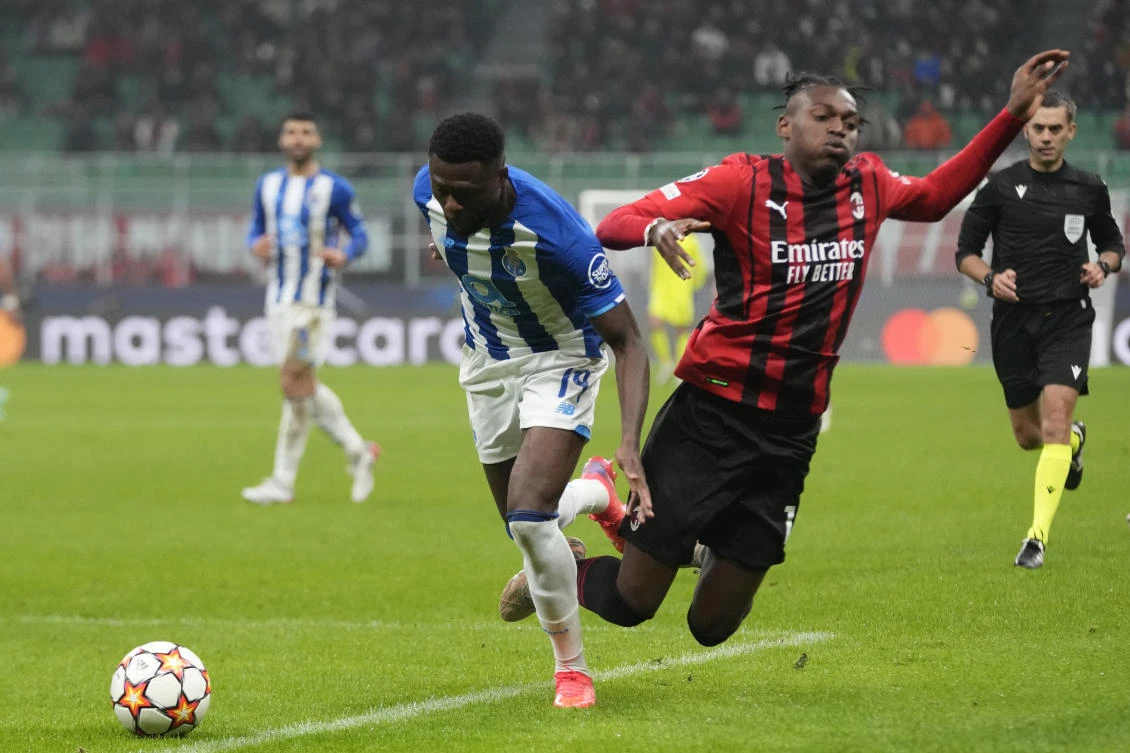 Milan draws 1-1 against Porto to keep faint CL hopes alive