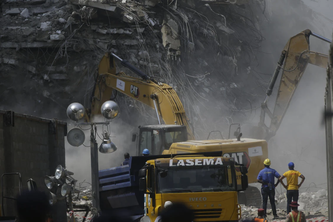 Rescue workers search for survivors in the rubble of the collapsed 21-storey apartment building under construction in Lagos, Nigeria on Nov. 3, 2021. (AP)