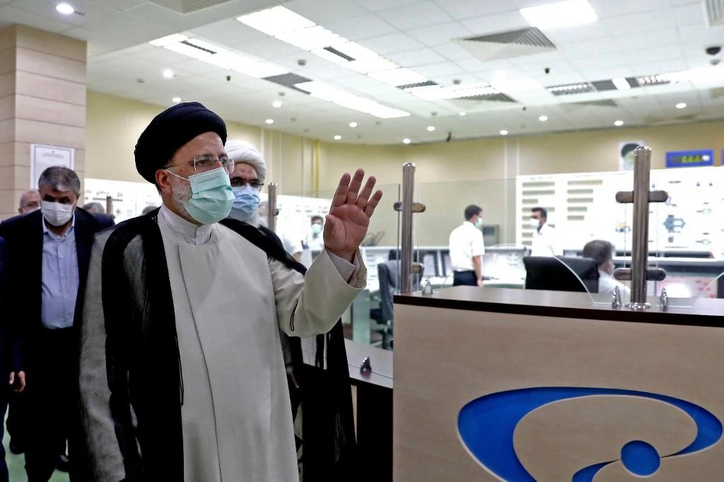 Above, Iran’s president Ebrahim Raisi visits the Bushehr Nuclear Power Plant in this handout picture provided by the Iranian presidency on Oct. 8, 2021. (Iranian Presidency via AFP)