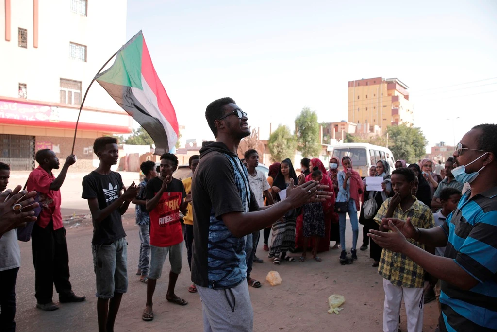 People chant slogans during a protest in Khartoum, amid ongoing demonstrations against a military takeover in Khartoum on Thursday. (AP)