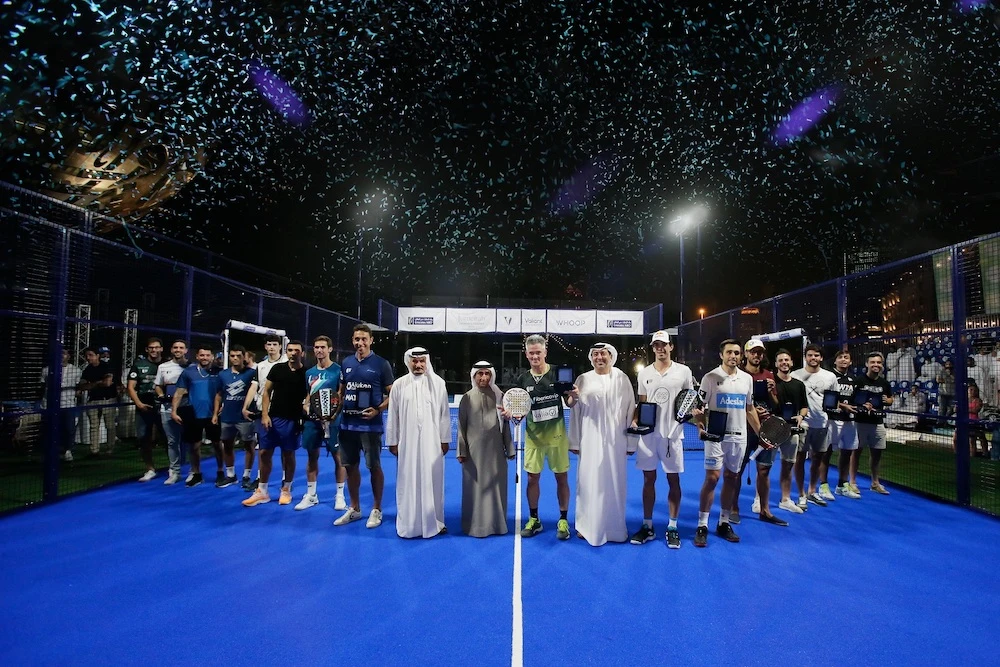 President of the UAE Padel Association Sheikh Saeed Bin Maktoum presents the Dubai Padel Cup to Juan Lebron and Miguel Lamperti. (Supplied)