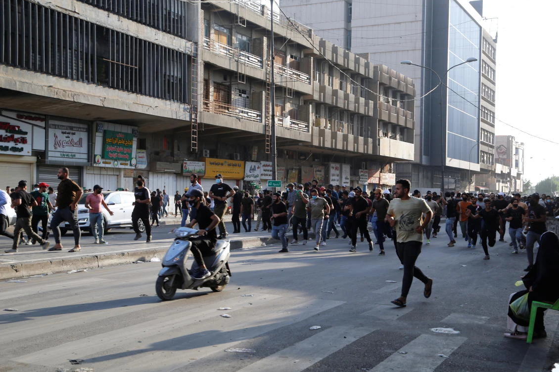 One killed dozens injured as Iraq police clash with pro-Iran protesters