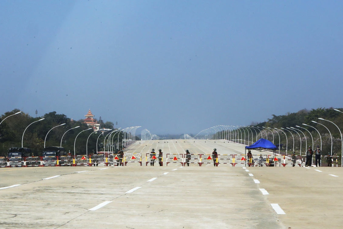 FILE - Soldiers stand to provide security near a road in Naypyitaw, Myanmar, Feb. 1, 2021. (AP)