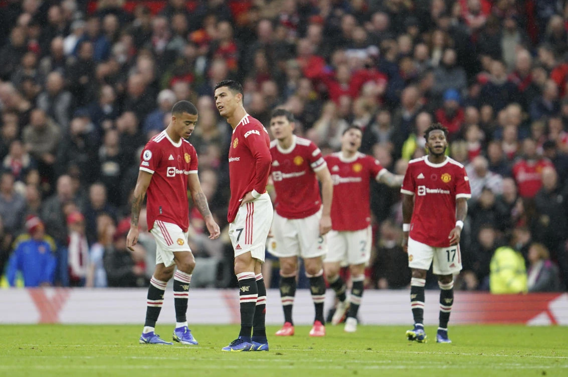 Manchester United's Cristiano Ronaldo reacts with his teammates after Manchester City's Bernardo Silva scored his side's second goal during the English Premier League match between Manchester United and Manchester City at Old Trafford. (AP)