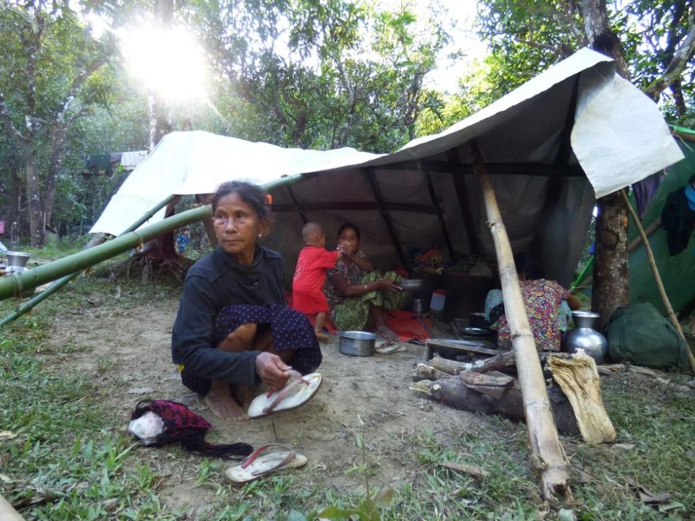 A family displaced from the recent fighting between Myanmar government troops and ethnic Arakan Army take shelter at a displacement camp in Kyauktaw township in Rakhine state. (AFP)