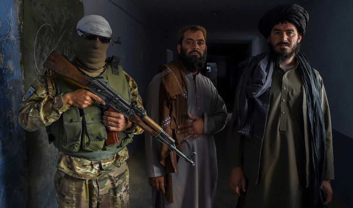 Taliban members stand guard inside a prison cell on the outskirts of Kabul. (AFP)