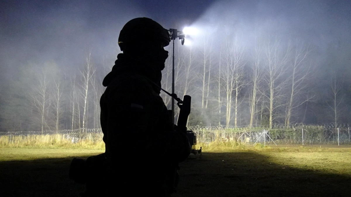 Polish soldiers patrol Poland/Belarus border near Kuznica, Poland, in this photograph released by the Territorial Defence Forces, November 15, 2021. (Reuters)