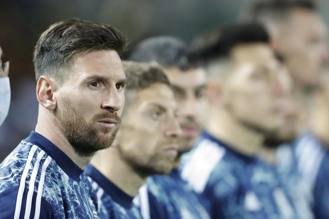 Argentina’s Lionel Messi sits on the bench during a qualifying soccer match against Uruguay’ for the FIFA World Cup Qatar 2022 in Montevideo, Uruguay on Friday. (AP)