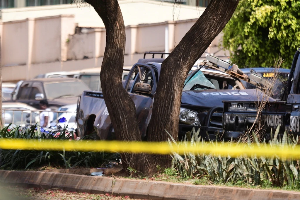 A general view shows wreckages of police vehicles at the scene of a blast in Kampala, Uganda November 16, 2021. (Reuters)
