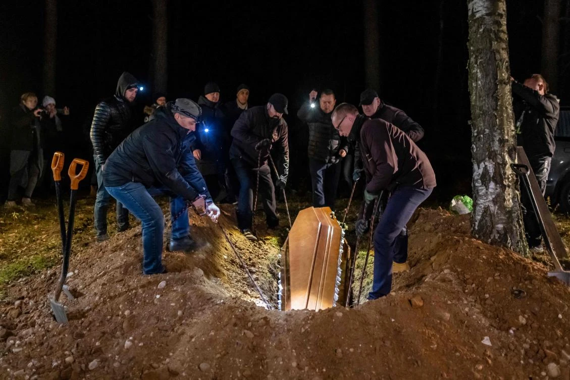 Imam Aleksander Bazarewicz says a prayer during the funeral ceremony of a 19-year-old Syrian refugee Ahmed who drowned in the border river Bug trying to get to Poland, Bohoniki, on Monday. (AFP)