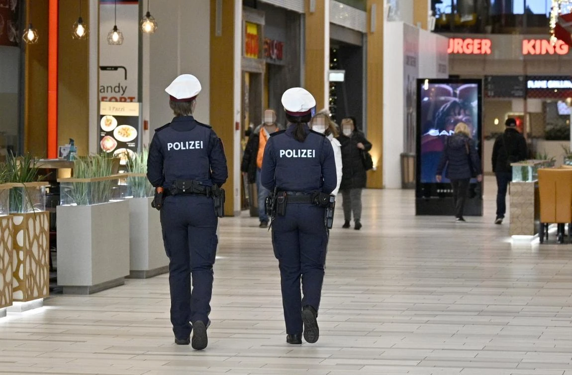 Austrian police officers patrol during a control in a shopping mall in Voesendorf, district Moedling, Austria, on November 16, 2021. (File/AFP)