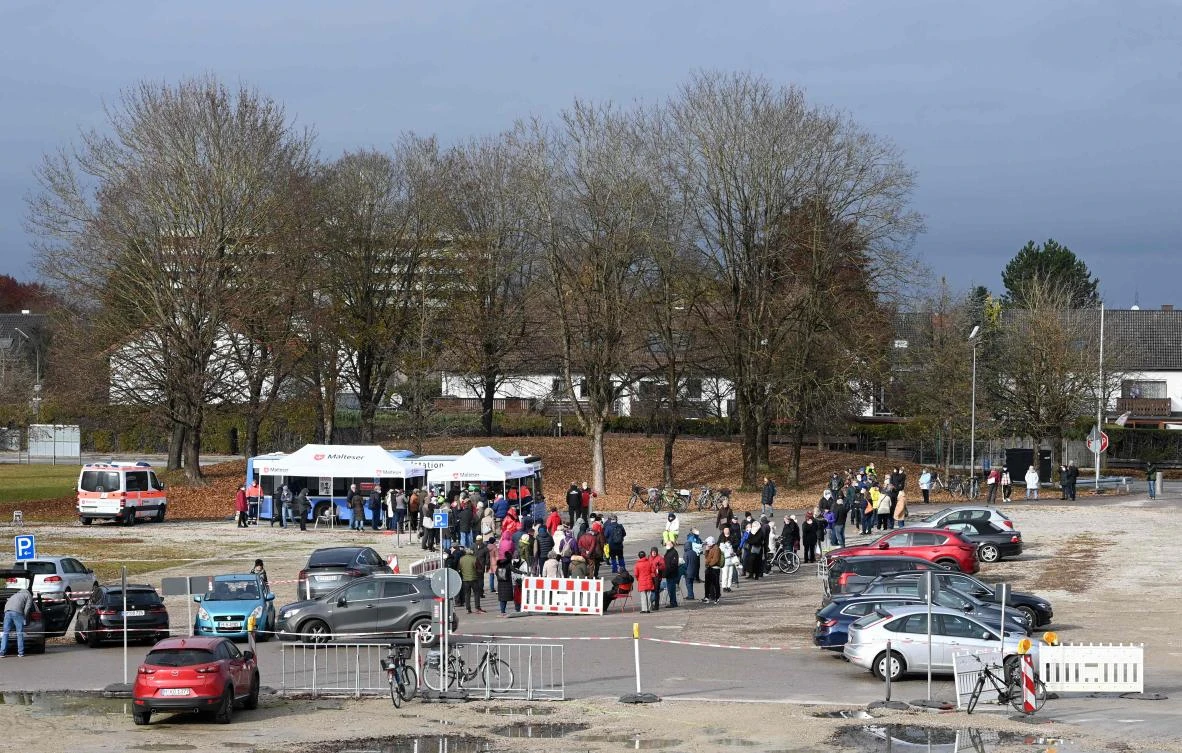 People queue at a vaccination bus that is parked in the small village of Unterschleissheim near Munich on Thursday amid the ongoing Covid-19 pandemic. (AFP)