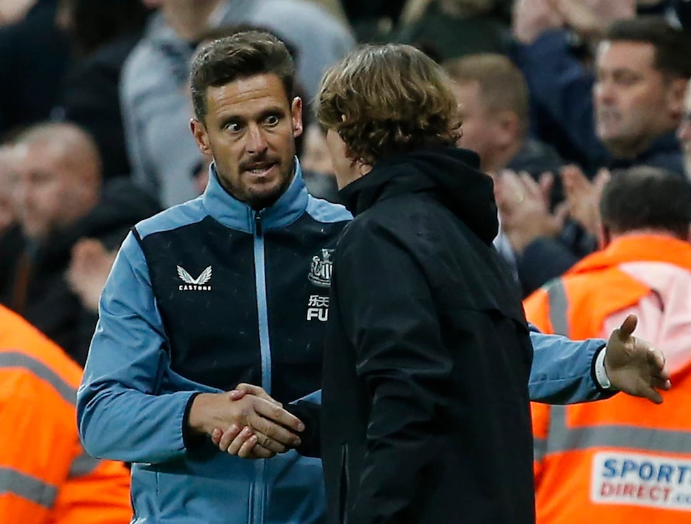 Newcastle United assistant head coach Jason Tindall shakes hands with Brentford manager Thomas Frank after the match. (Reuters)